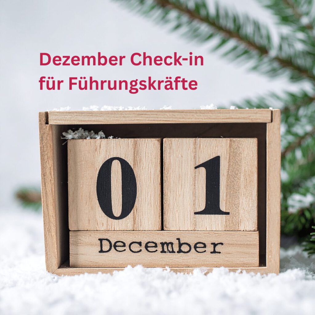 Holzkalender mit dem Datum 01. Dezember im Schnee als Symbol für den Dezember Check-in für Führungskräfte.
